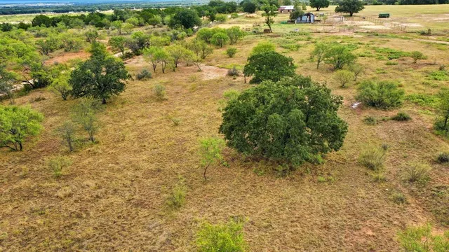 a view of residential houses with yard