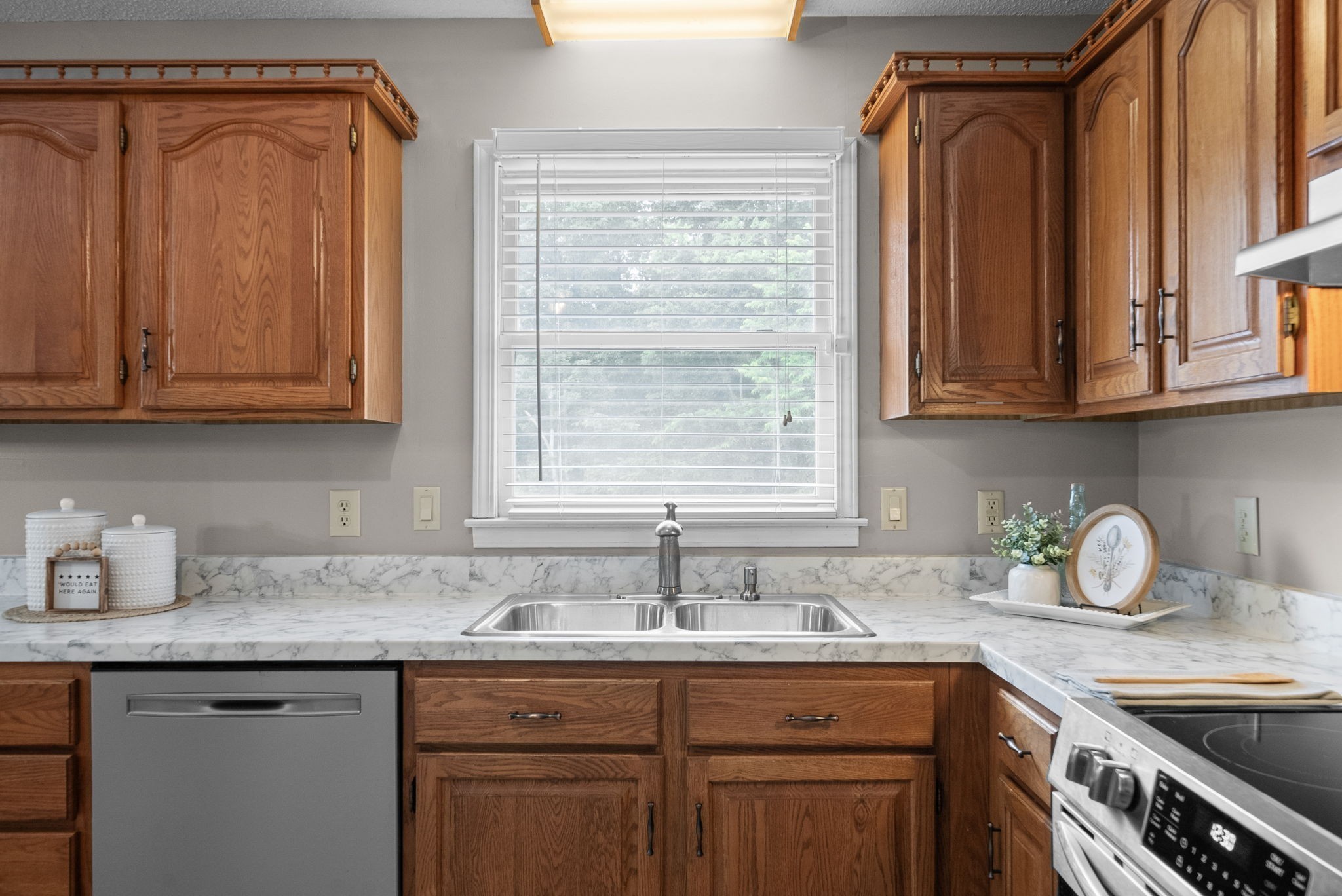 2430 Underwood Road Cunningham, TN 37052 - Photo 11 of 49 a kitchen with granite countertop a sink stainless steel appliances cabinets and a window