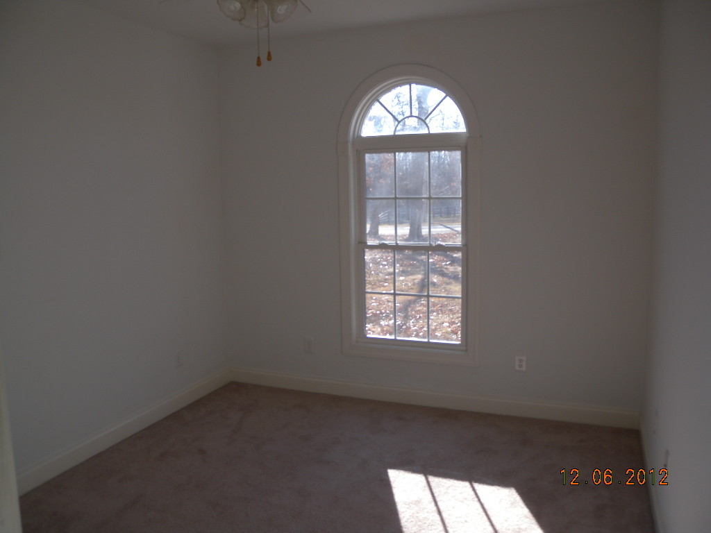 203 Mallard Point Road Wirtz, VA 24184 - Photo 15 of 24 an empty room with windows and mirror