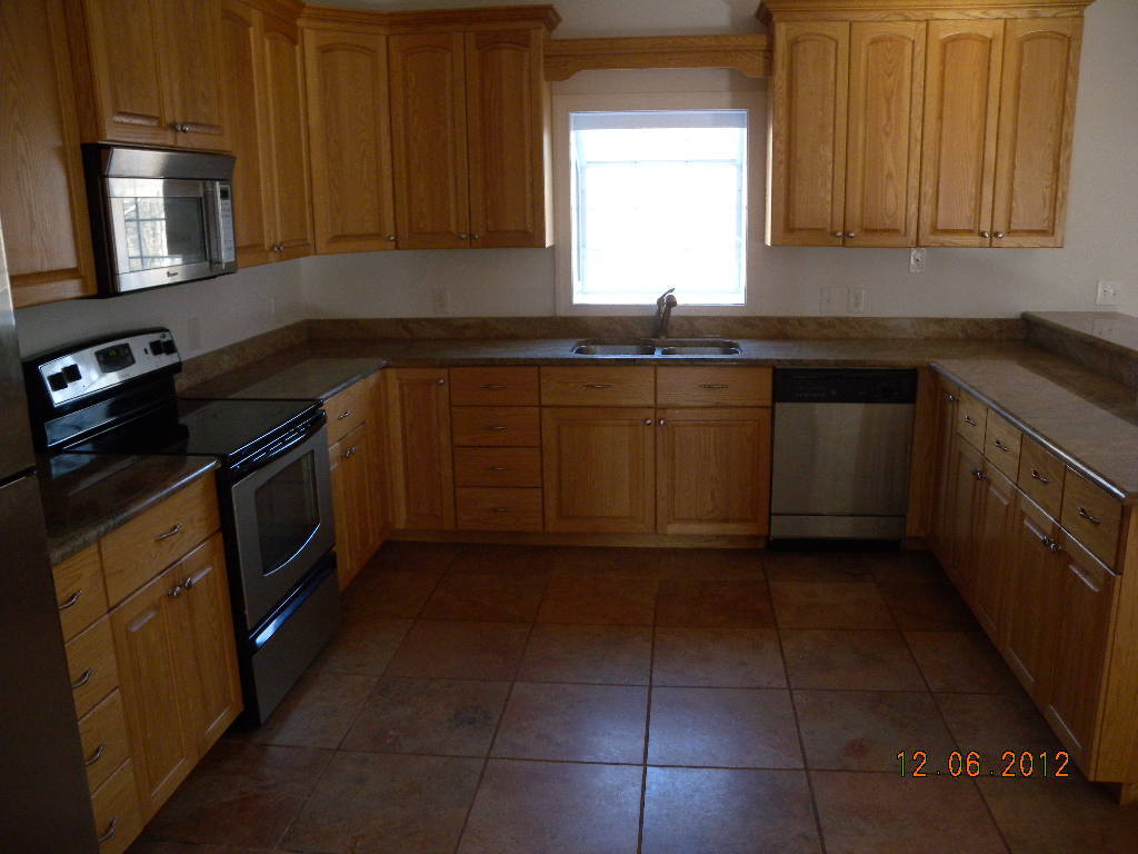 203 Mallard Point Road Wirtz, VA 24184 - Photo 5 of 24 a kitchen with a sink a stove and cabinets