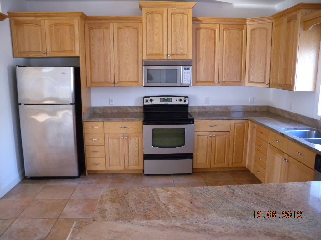 203 Mallard Point Road Wirtz, VA 24184 - Photo 6 of 24 a kitchen with granite countertop a stove top oven and cabinets