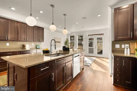 a kitchen with a sink cabinets and window