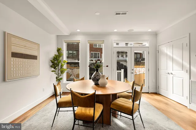 a view of a dining room with furniture and window