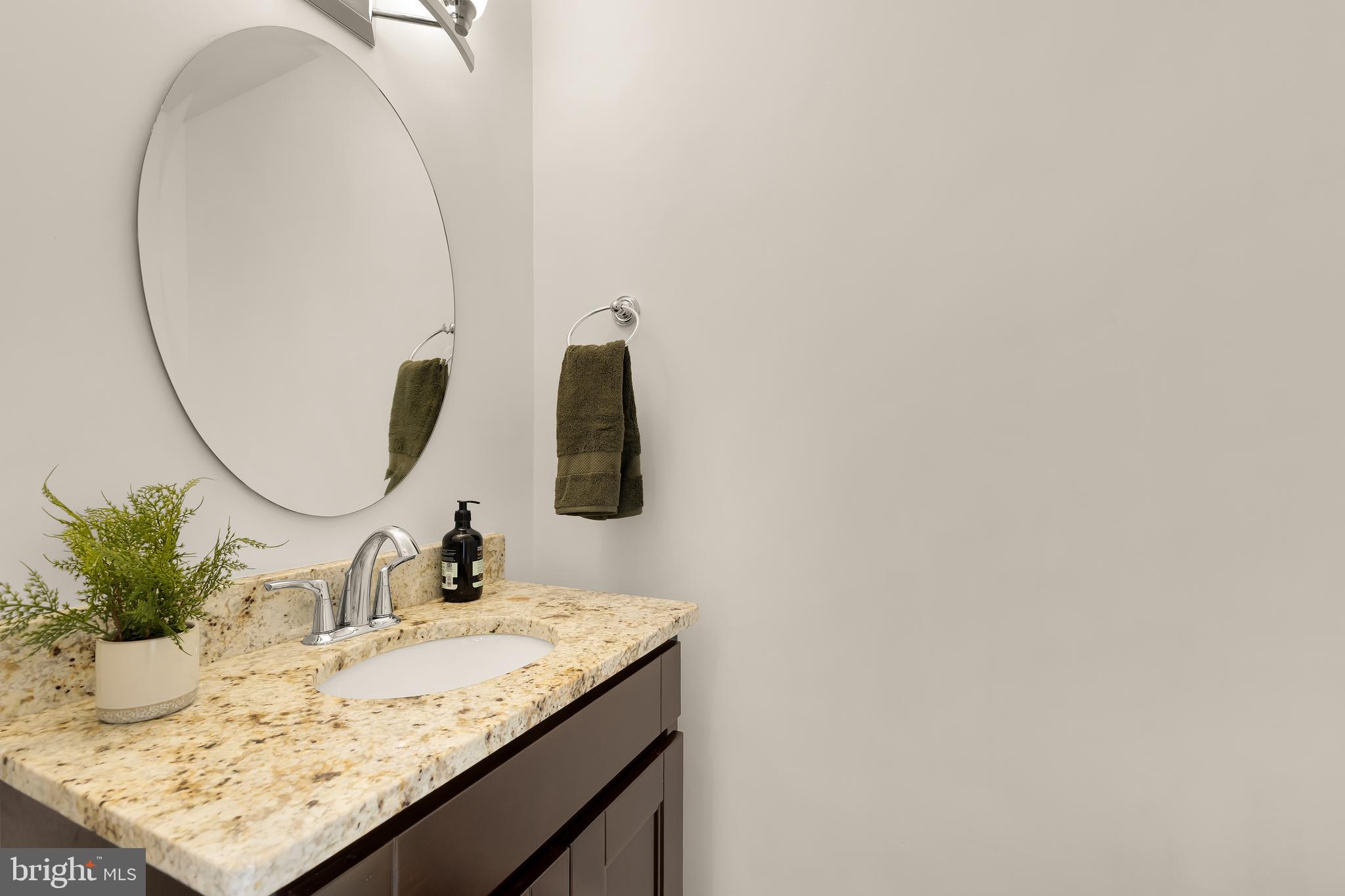 1350 Perry Place Northwest Washington, DC 20010 - Photo 16 of 53 a bathroom with a granite countertop sink and a mirror