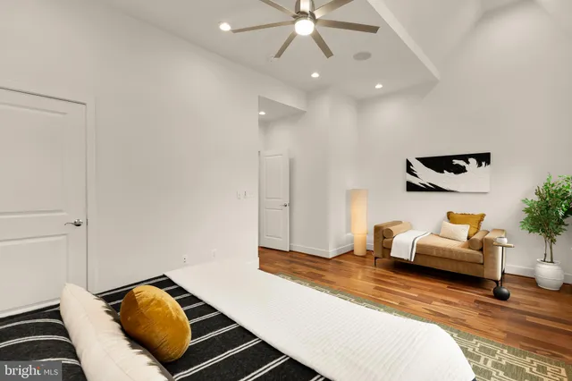 a bedroom with a large bed and a window