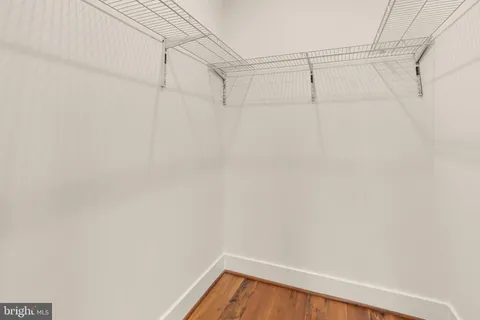 a bathroom with a sink vanity mirror and toilet