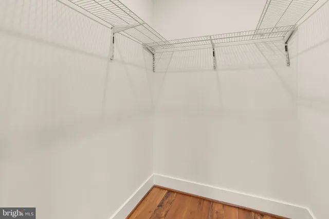 a bathroom with a sink vanity mirror and toilet