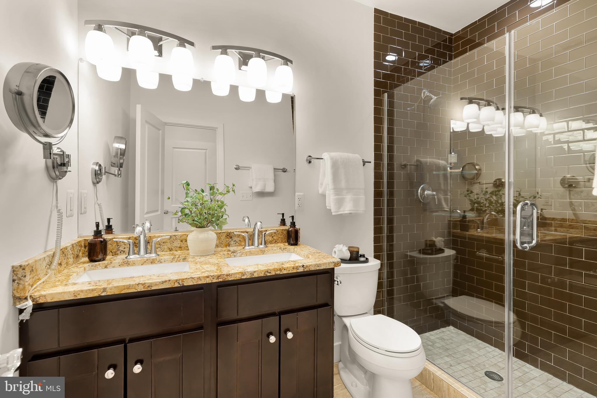 1350 Perry Place Northwest Washington, DC 20010 - Photo 22 of 53 a bathroom with a sink vanity mirror and toilet