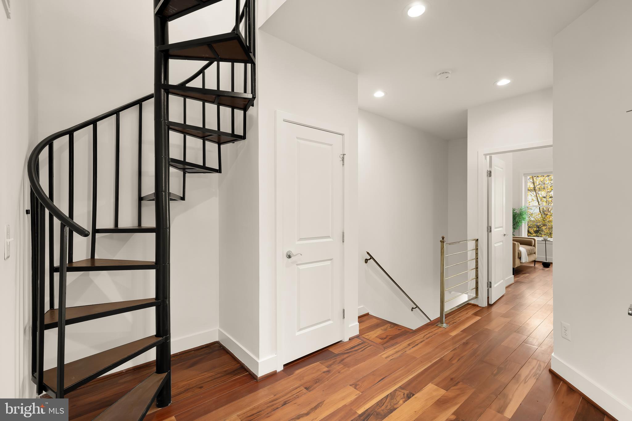 1350 Perry Place Northwest Washington, DC 20010 - Photo 31 of 53 a view of a hallway with wooden floor and stairs