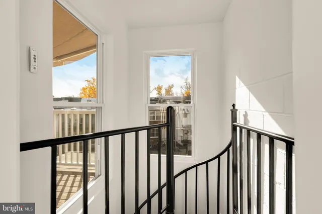 a view of a balcony with wooden floor