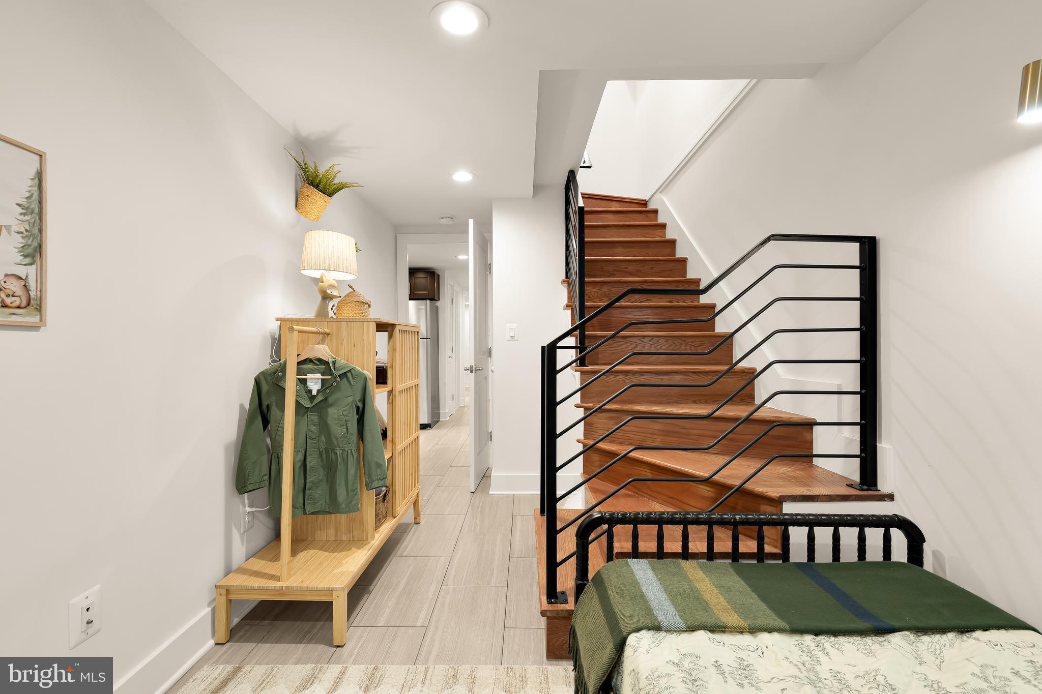 1350 Perry Place Northwest Washington, DC 20010 - Photo 37 of 53 a bedroom with a bed and a painting on the wall