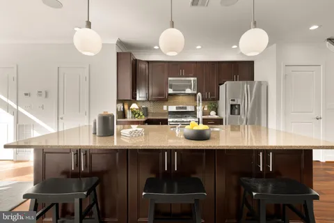 a kitchen with counter space cabinets and appliances
