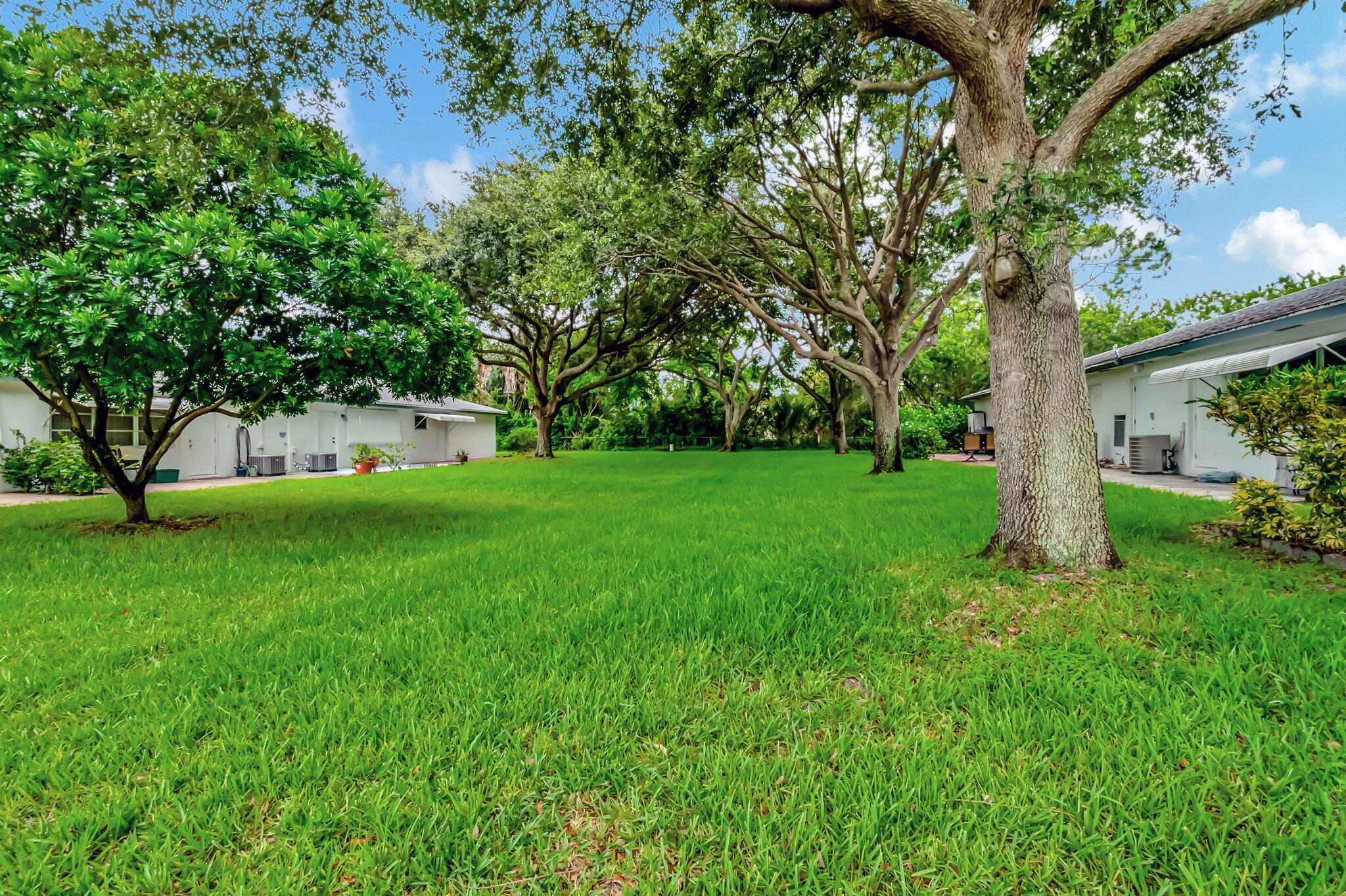 1217 South Drive Way, Unit A Delray Beach, FL 33445 - Photo 27 of 27 a green field with lots of trees