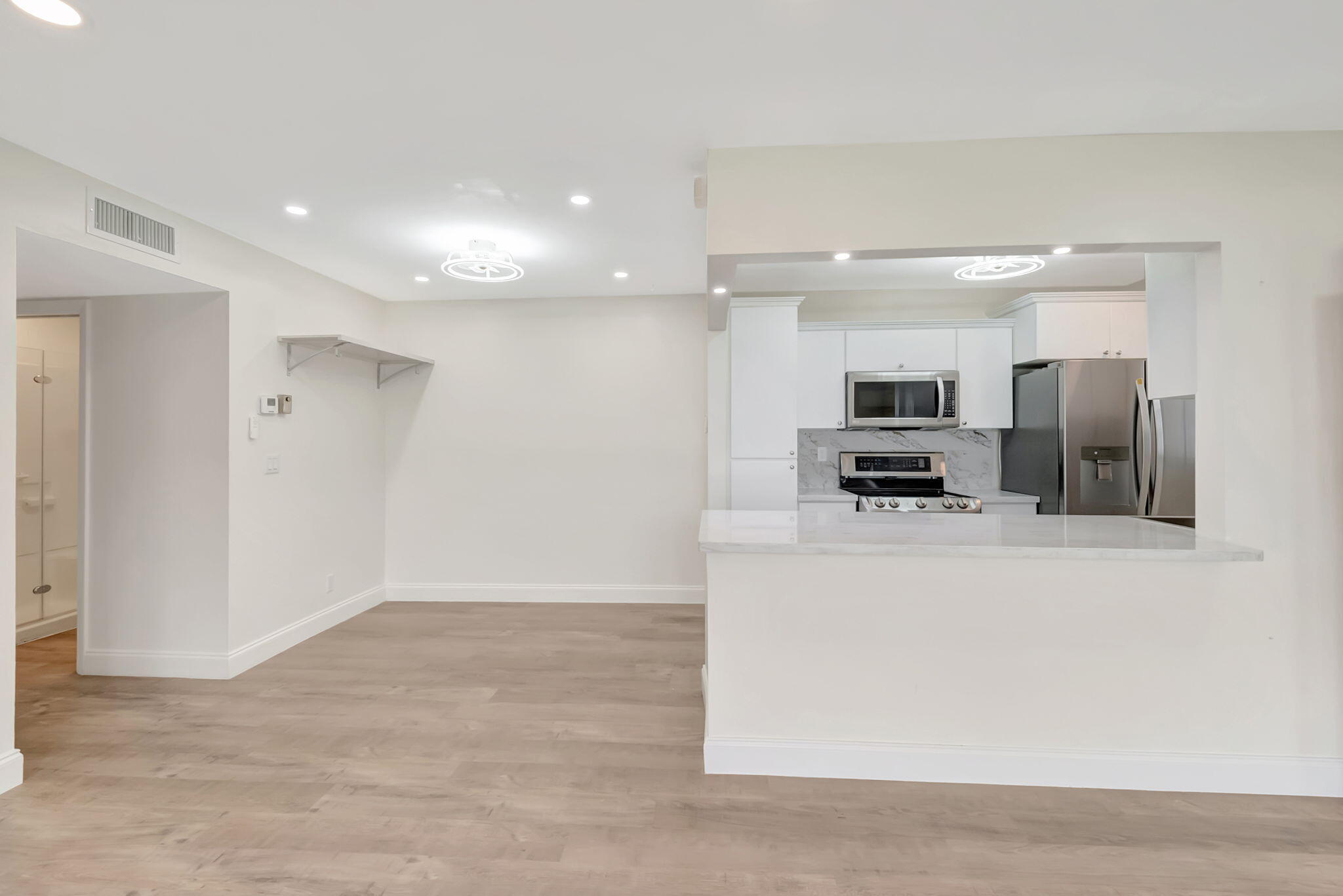 1217 South Drive Way, Unit A Delray Beach, FL 33445 - Photo 10 of 27 a view of kitchen with stainless steel appliances kitchen island