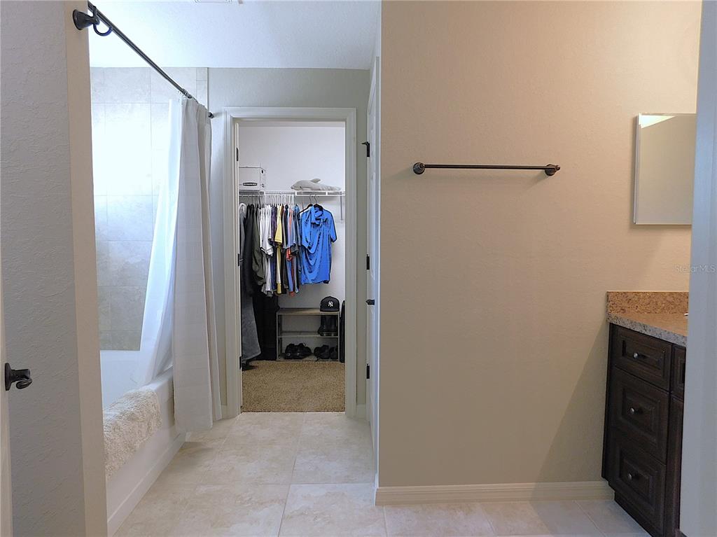 17477 Southwest 36th Terrace Ocala, FL 34473 - Photo 23 of 47 a view of a hallway with closet and a bathroom