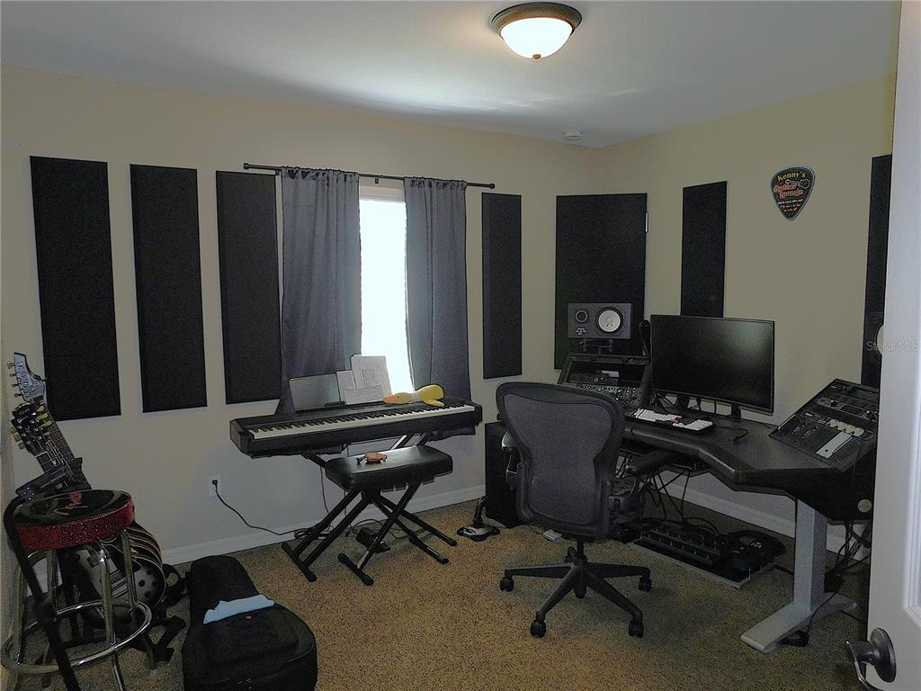 17477 Southwest 36th Terrace Ocala, FL 34473 - Photo 29 of 47 a view of a workspace with furniture and a window