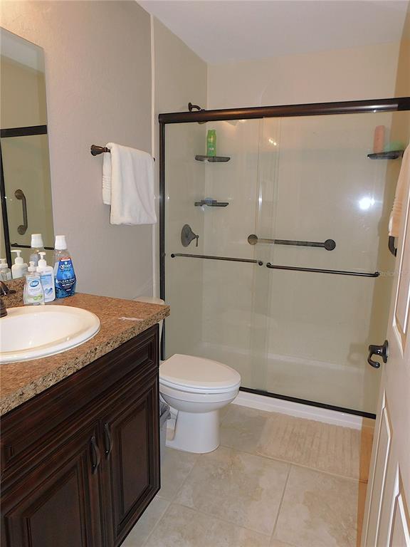 17477 Southwest 36th Terrace Ocala, FL 34473 - Photo 35 of 47 a bathroom with a granite countertop sink toilet and shower