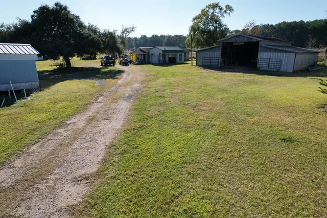 a street view with couple of cars parked