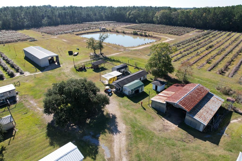 6934 Biscamp Road Silsbee, TX 77656 - Photo 15 of 38 a view of a swimming pool with a patio