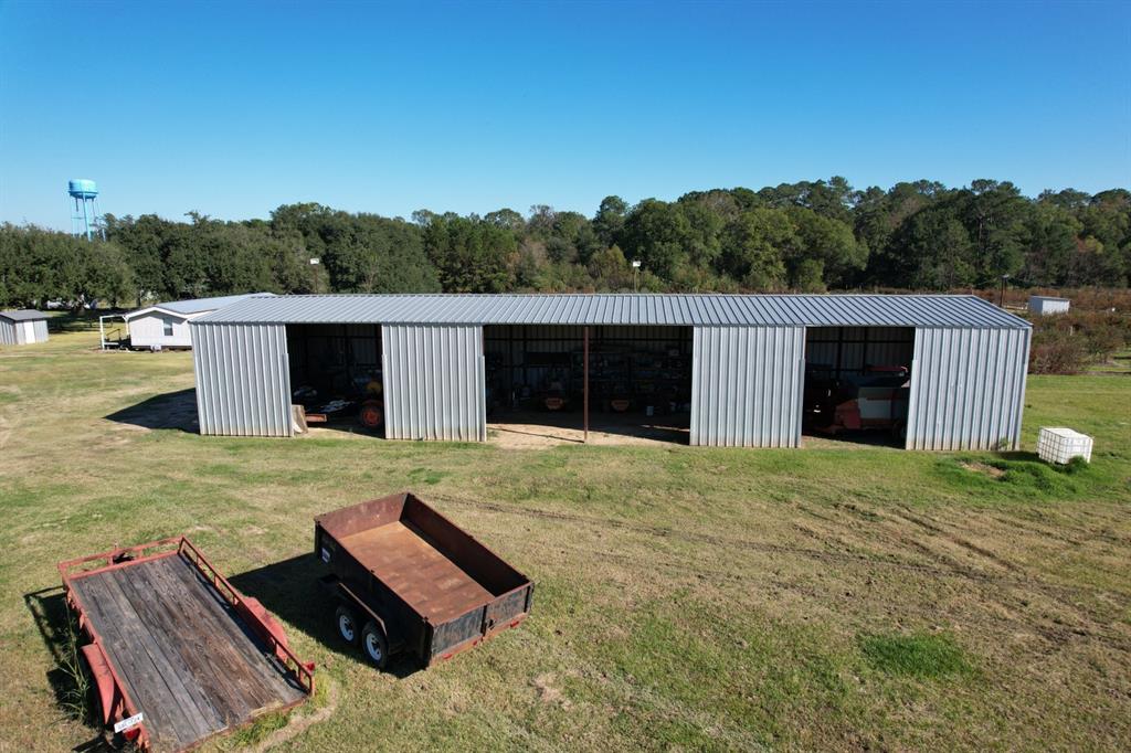 6934 Biscamp Road Silsbee, TX 77656 - Photo 18 of 38 a backyard of a house with table and chairs