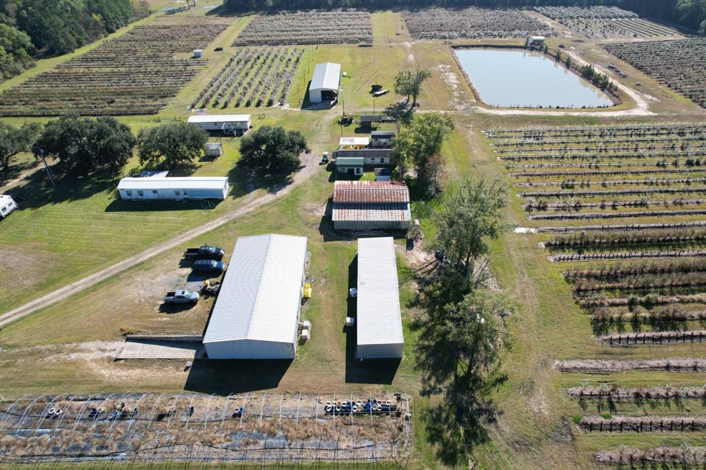 6934 Biscamp Road Silsbee, TX 77656 - Photo 8 of 38 a picture of a building with a garden view
