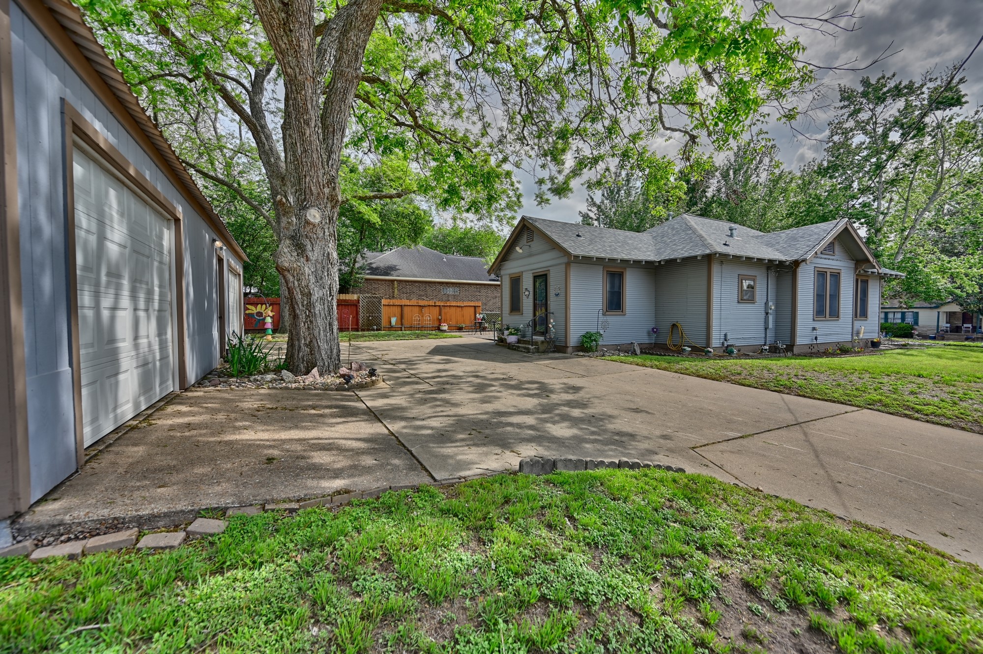 1501 South Austin Street Brenham, TX 77833 - Photo 30 of 36 a front view of a house with garden