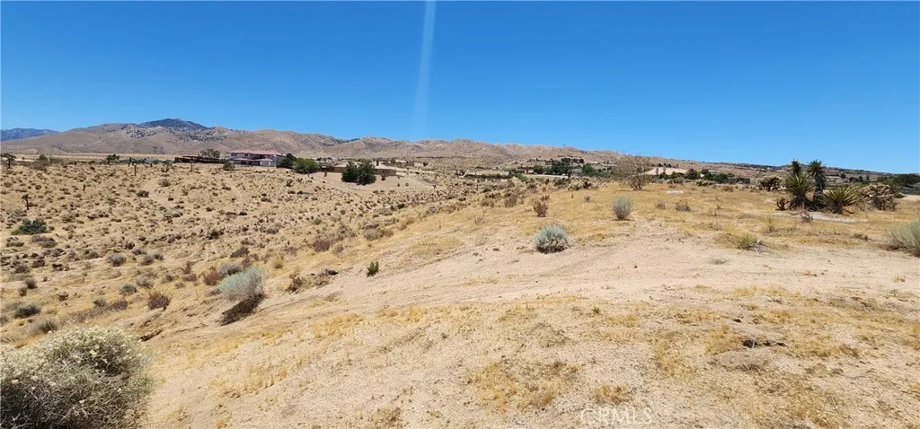 1 Rancho Street Apple Valley, CA 92308 - Photo 10 of 30 a view of a dry yard with mountains in the background