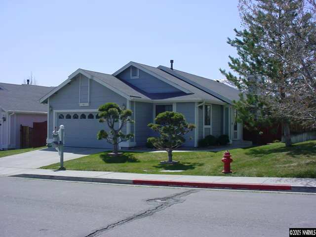 5950 Bankside Way Reno, NV 89523 - Photo 1 of 6 a house that has a tree in front of it