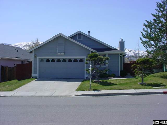 5950 Bankside Way Reno, NV 89523 - Photo 2 of 6 a front view of a house with a yard and garage