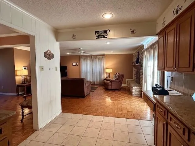 a large white kitchen with a large window