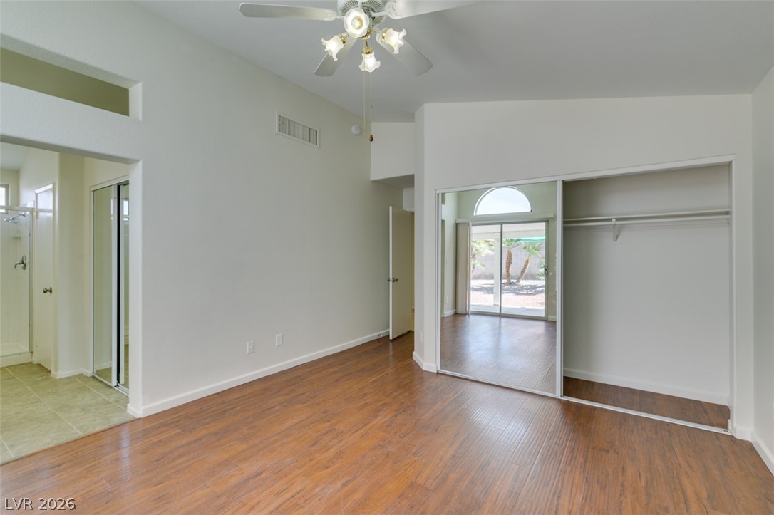 307 Cavalla Street Henderson, NV 89074 - Photo 36 of 44 Hardwood floors and a mirrored closet create an open, airy feel with a view of the outside.