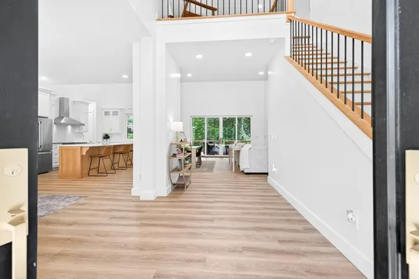 a view of a living room and entryway