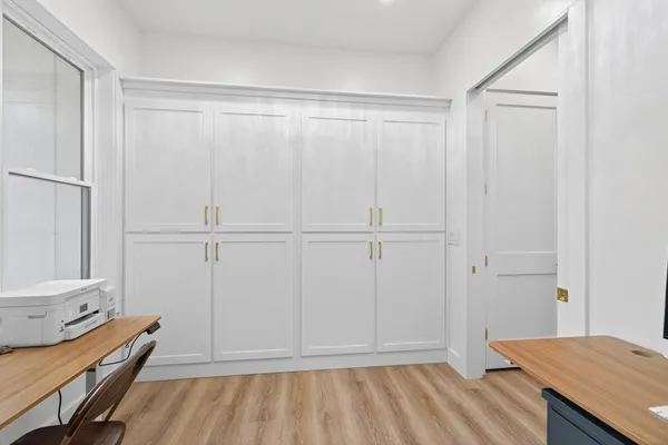 a living room with furniture and flat screen tv