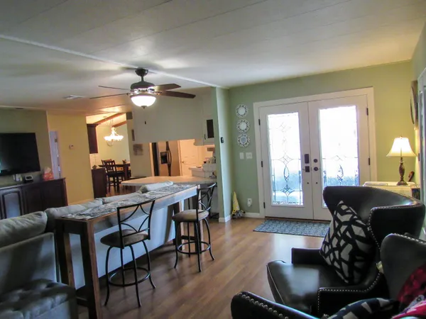 a view of a dining room with furniture window and wooden floor