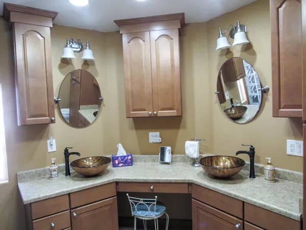 a kitchen with a sink and a mirror