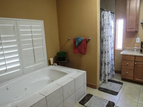 a bathroom with a bathtub and shower