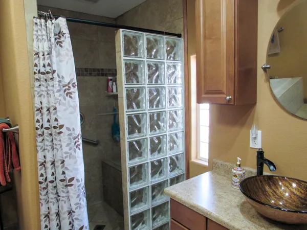 a bathroom with a sink and a mirror