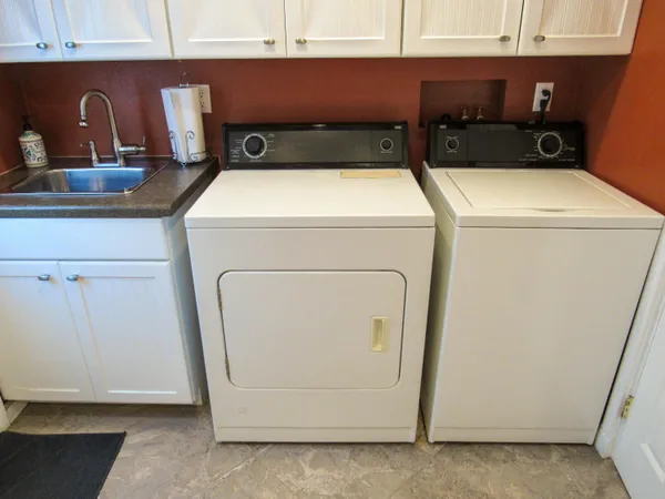 a utility room with dryer and washer
