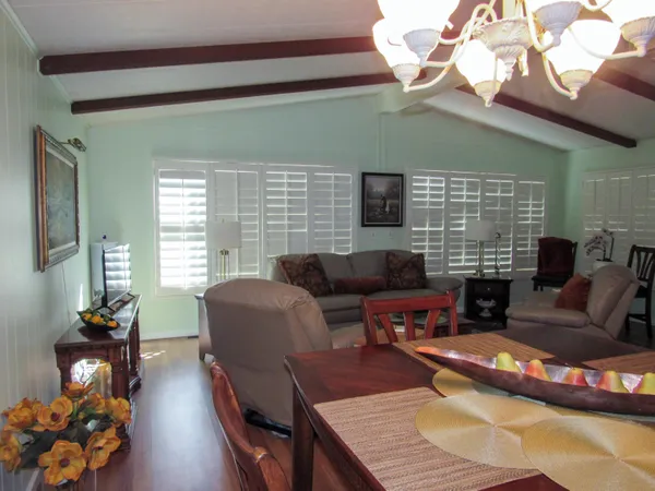 a living room with furniture wooden floor and a fireplace