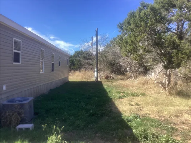 a view of a yard with plants