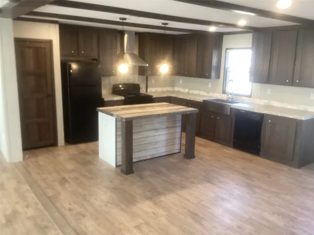 a view of a kitchen counter top space and stainless steel appliances