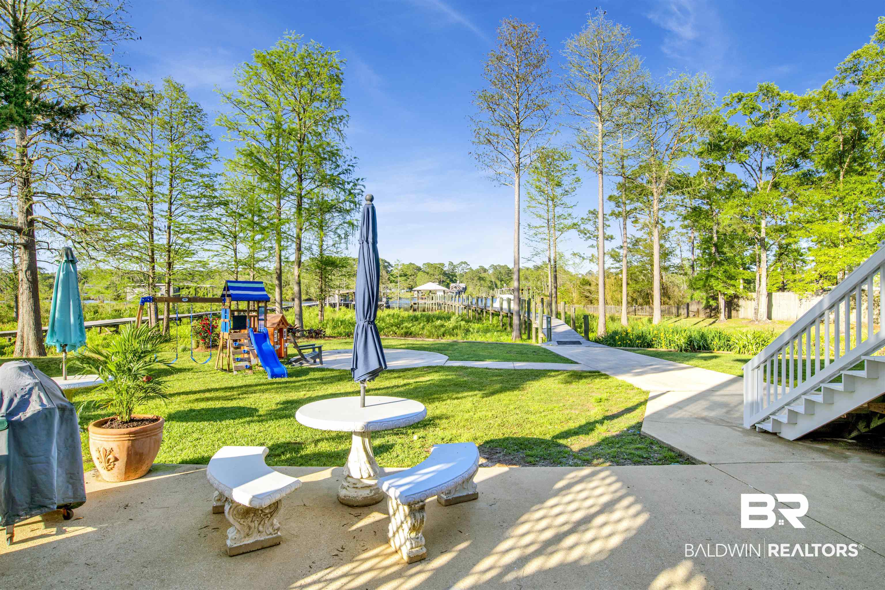 11463 Getchell Drive Theodore, AL 36582 - Photo 34 of 39 Exterior space featuring a playground and a lawn