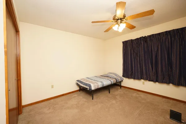 a living room with a bed