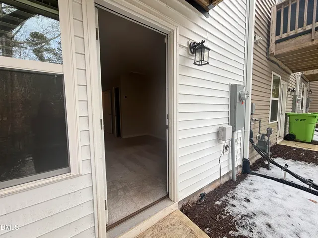 an entryway and a hallway with window