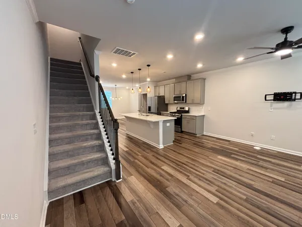 a view of kitchen with cabinets