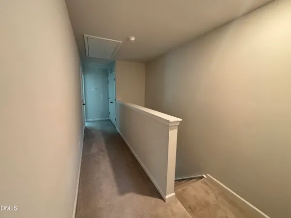 a bathroom with a granite countertop toilet a sink and a mirror