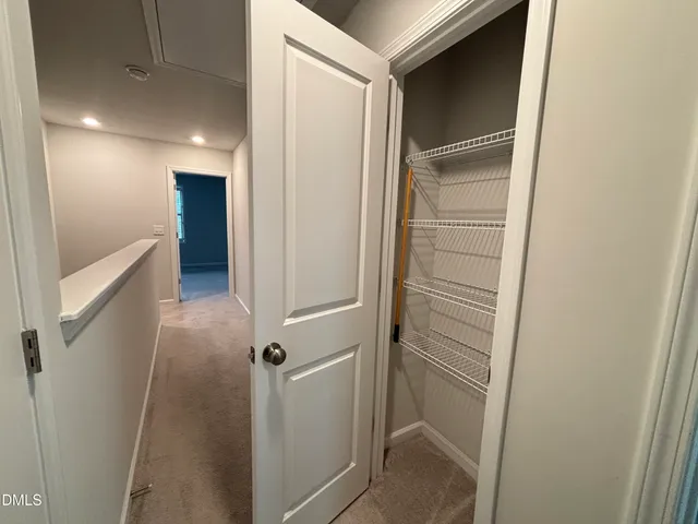 a bathroom with a sink and mirror with toilet