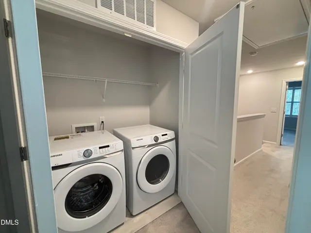 a white toilet sitting next to a bath tub