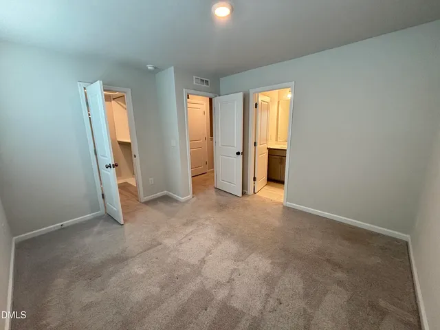 a kitchen that has a microwave a stove and a refrigerator