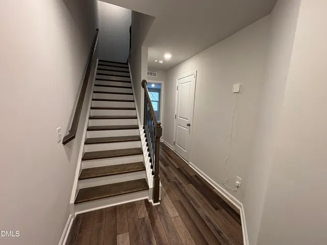 a view of entryway with wooden floor